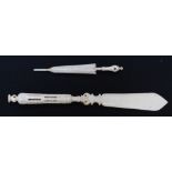 A Stanhope carved bone needle case modelled as an umbrella and another modelled as a paperknife.