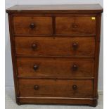 A Victorian walnut chest of two short and three long graduated drawers with turned pulls, (one