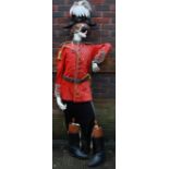 A 19th century British Army red coat trousers, cocked hat and brown leather boots with stretchers