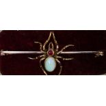 An Edwardian 9ct gold spider bar-brooch, the main body set with an oval cabochon-cut opal, 8.5mm x