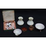 A group of assorted porcelain including Belleek, a Royal Crown Derby porcelain lily brooch and