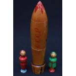 A rare early 1960s wooden Russian doll modelled as a space rocket, marked 'CCCP', containing two