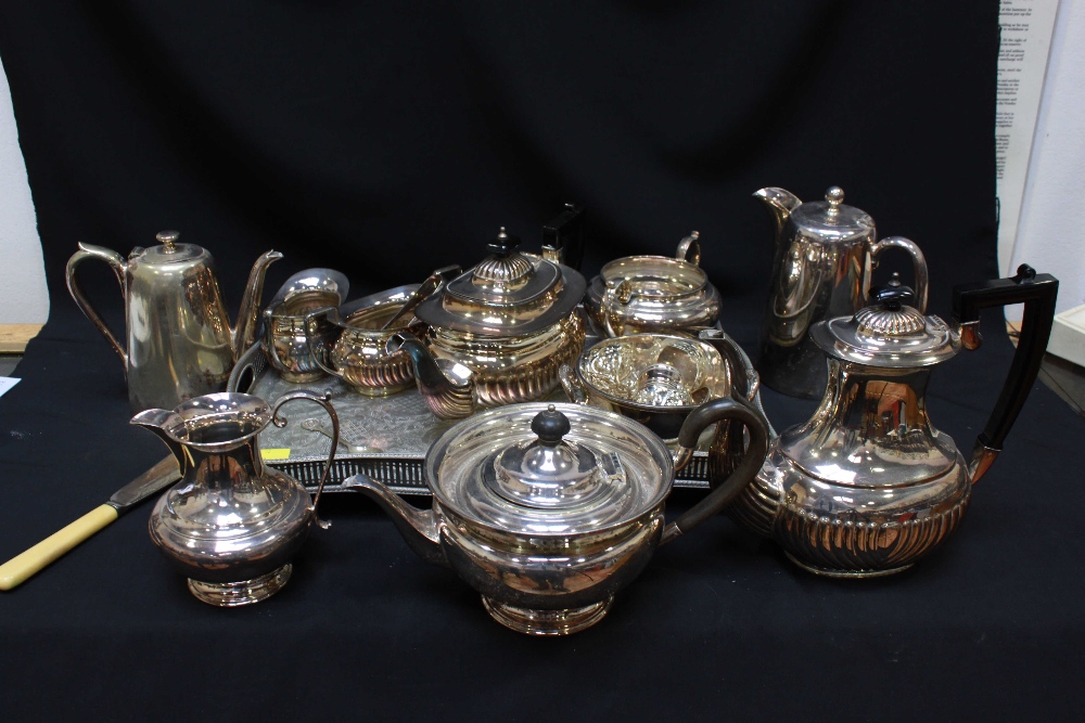 A Viners plated and engraved gallery tray and a four piece tea and coffee set together with a