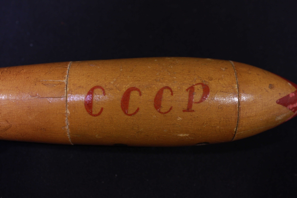 A rare early 1960s wooden Russian doll modelled as a space rocket, marked 'CCCP', containing two - Image 2 of 2