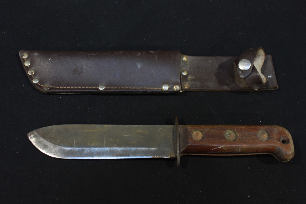 A British Wilkinson type D. MOD survival knife and scabbard