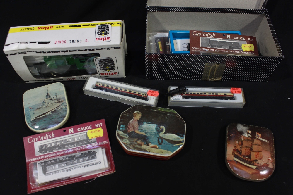 A large collection of model miniature toy trains, engines, rolling stock, carriages and track