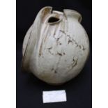A large Studio pottery vase by Martin Ward, of abstract form in oatmeal glaze with twin openings and