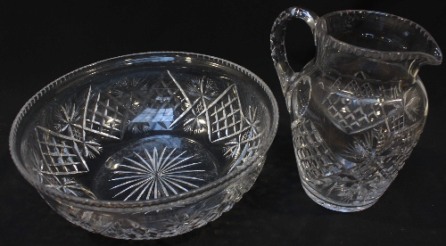 An early 20th century cut and moulded glass set of ewer and wash basin.