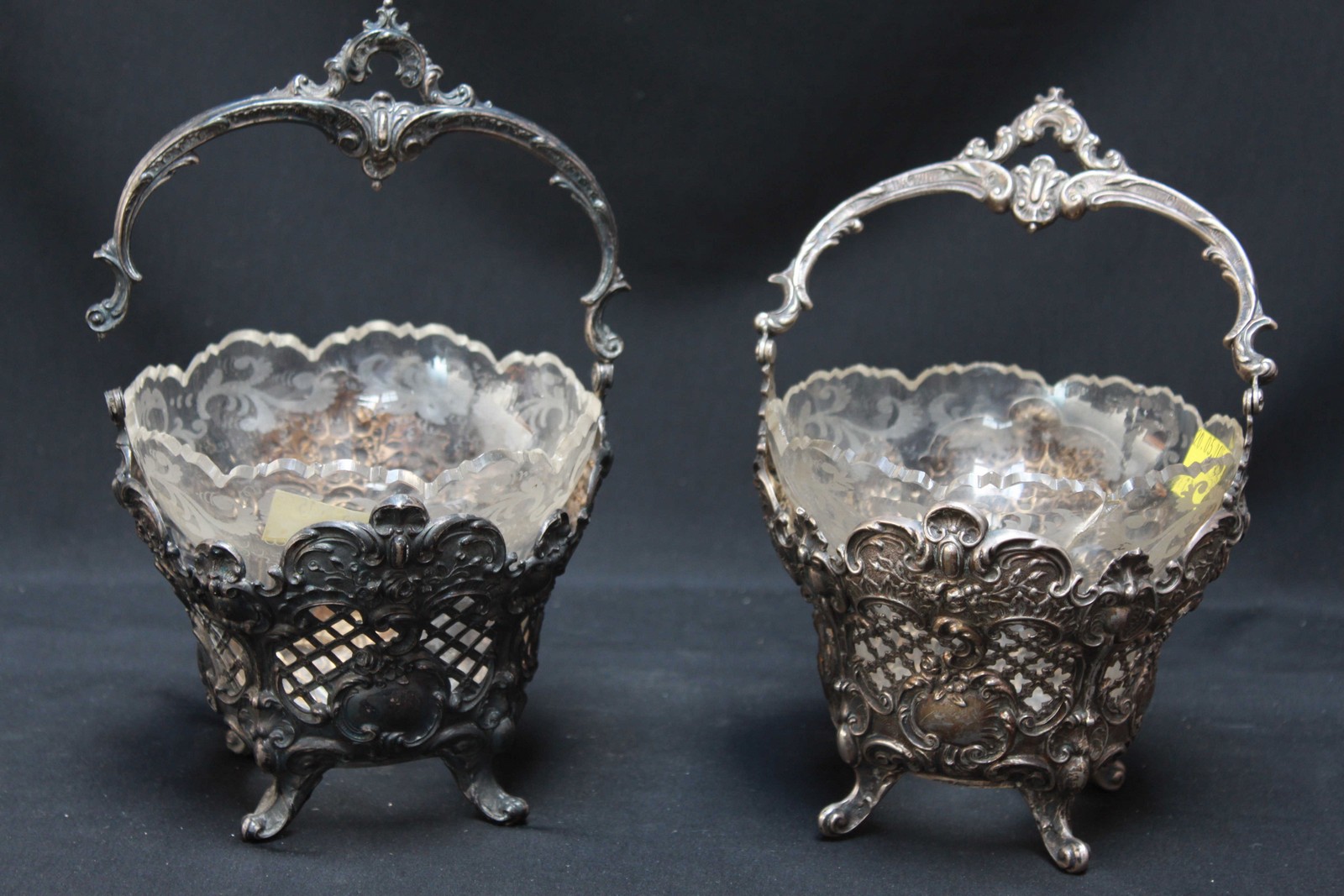 A matched pair of 19th century Continental white metal embossed sweet meat baskets, one marked .800,