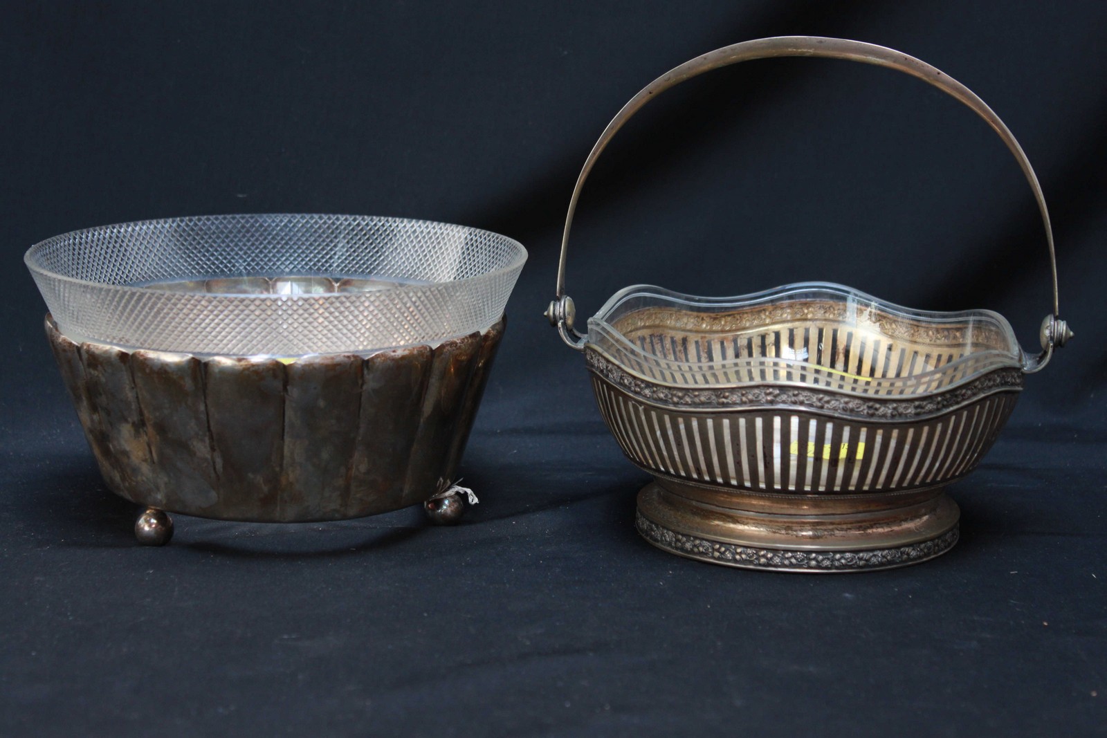 Two Continental .800 silver bowls with glass liners, one of fluted form, the other with swing handle