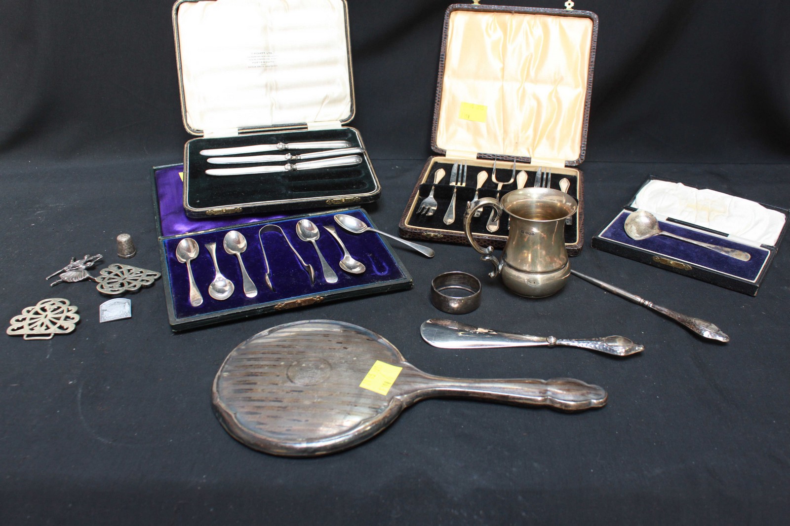 A small quantity of silver items including set of coffee spoons, three fruit knives, hand-mirror,