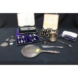 A small quantity of silver items including set of coffee spoons, three fruit knives, hand-mirror,