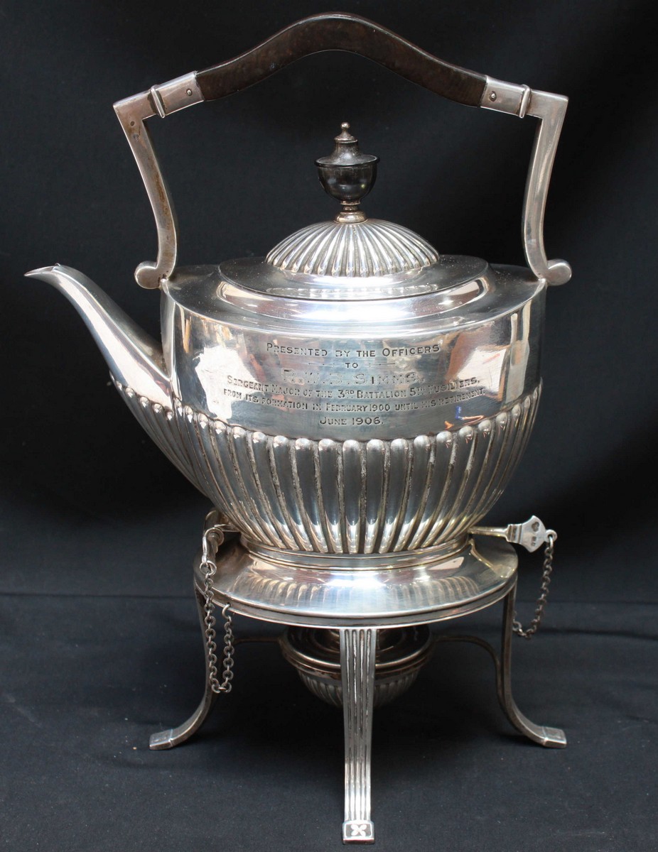 An Edwardian silver kettle on stand with spirit burner, half-reeded body and domed cover, ebonised