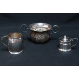 A London silver embossed porringer, together with a small Birmingham silver barrel shaped tankard