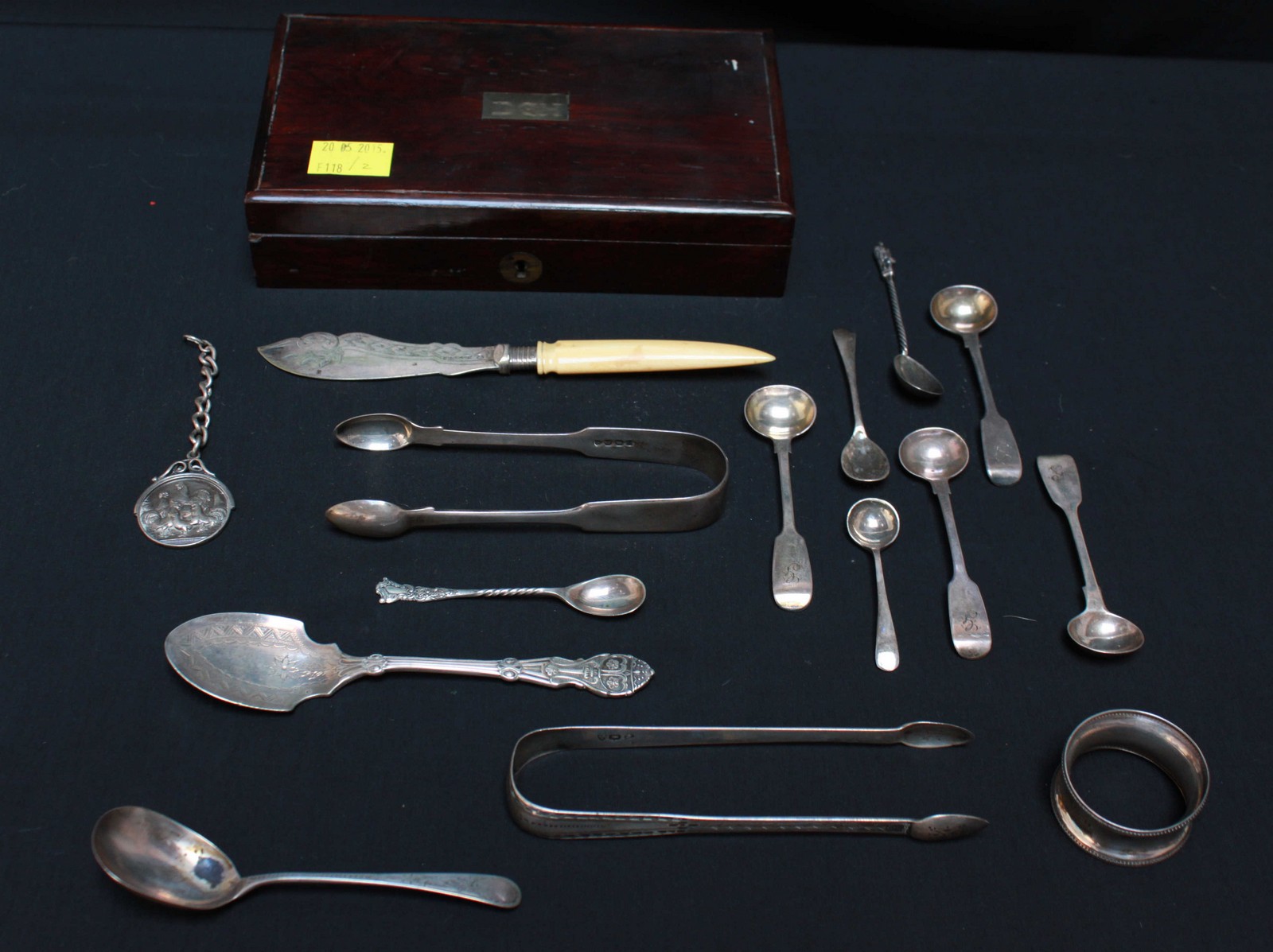A collection of assorted silver and silver plated items including sugar nips, a napkin ring and salt