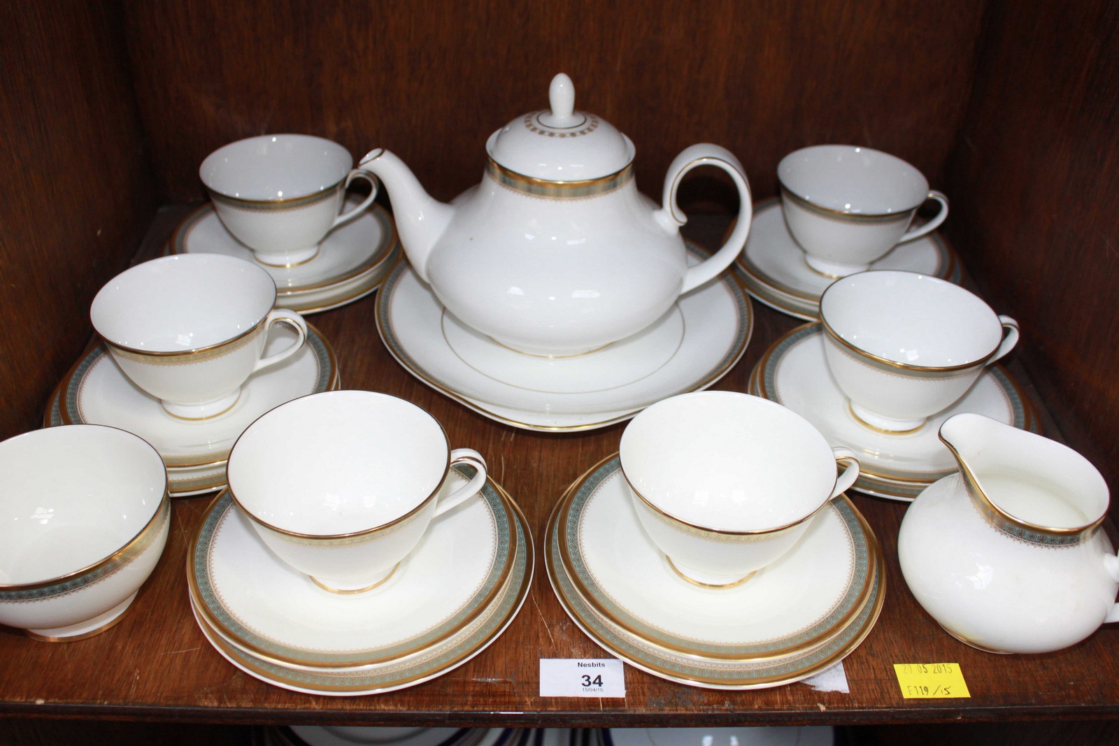 SECTION 34.  A Royal Doulton "Clarendon" pattern six-place teaset with teapot, cream and sugar bowl,