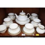 SECTION 34.  A Royal Doulton "Clarendon" pattern six-place teaset with teapot, cream and sugar bowl,