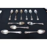 Eleven Kings pattern silver dessert spoons, various makers and dates, 21oz.