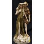 A large Royal Dux art nouveau figure group of a young couple walking hand in hand on a