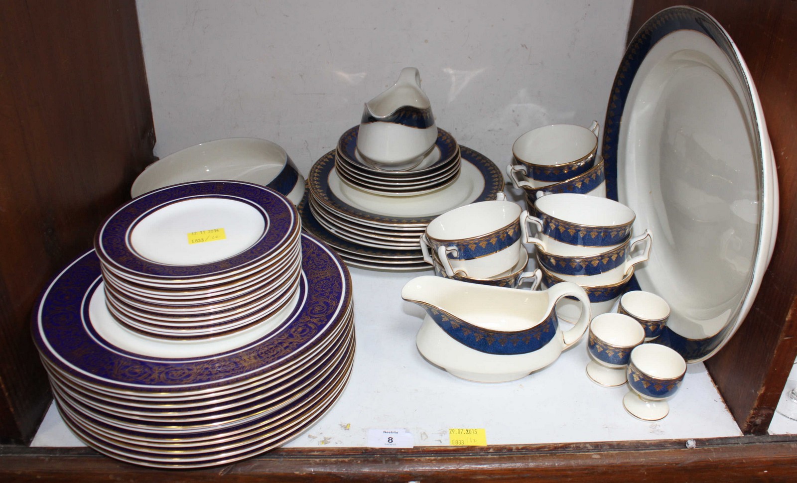 SECTION 8. A quantity of Royal Doulton Imperial Blue dinner and side plates, together with a similar