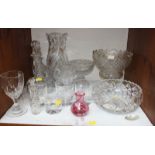 SECTION 13. A shelf of assorted cut crystal and glassware including a heavy cut stemmed fruit