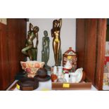 SECTION 21. A shelf of assorted items including three large Art Deco style painted plaster ladies,