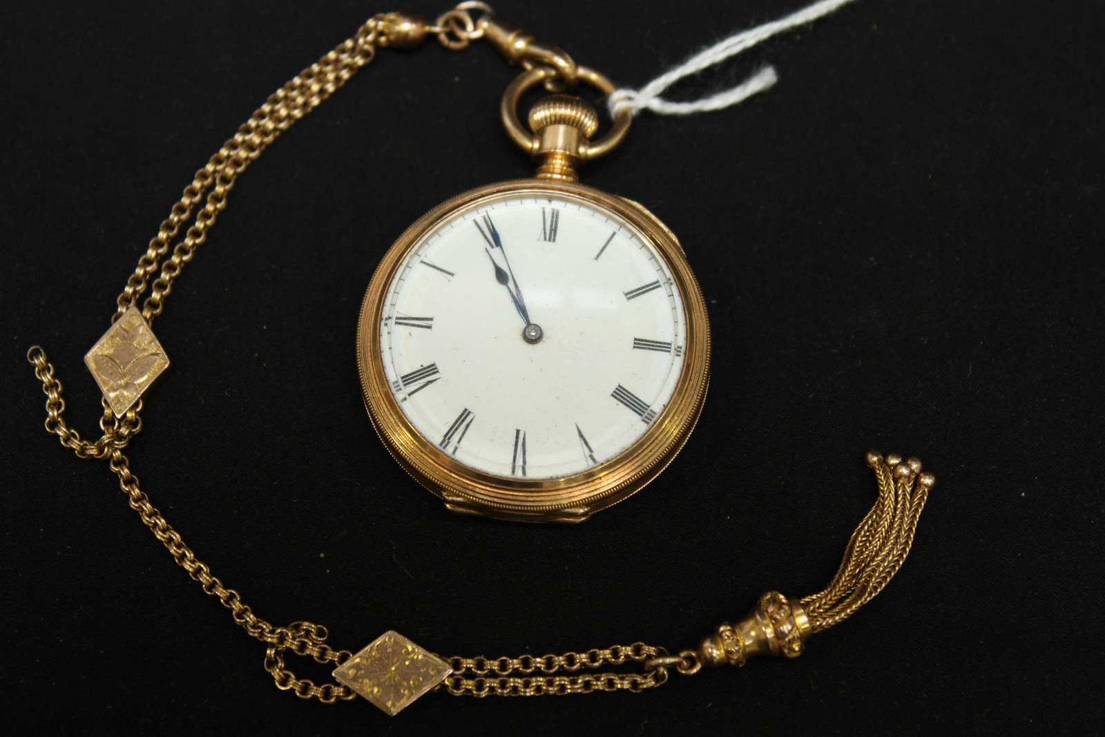 A Victorian 18K Waltham pocket watch, the white enamel dial with black Roman numerals, with banded