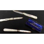 Three silver and ivory fruit knives, one in a leather case.