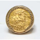 A 1915 George V 22ct gold half sovereign in a 9ct gold ring mount. 11.7 grams.