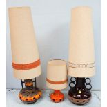 Two large and a small West German pottery table lamps with shades. (3)