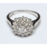 A ladies 18ct white gold, platinum and diamond tier dress ring, set with circular, brilliant cut