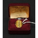 An Edwardian 1903 22ct gold half sovereign ring, with 9ct gold shank. Total weight 5 grams.