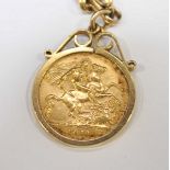 A George V 1911 22ct gold half sovereign in a 9ct gold mount and suspended on a 9ct gold chain.