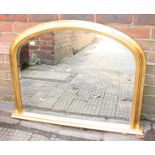 A modern gilt-framed over-mantel mirror with arched top, approximately 74cm x 90cm