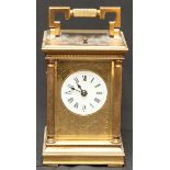 A 20th century Charles Frodsham brass repeating carriage clock, with white enamel and black Roman