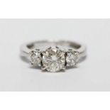 A ladies 14ct white gold diamond ring, claw set with central stone, VS clarity brilliant cut
