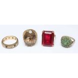 Four 9ct gold rings, including a large smoky quartz ring, a red stone ring, a cluster ring and an
