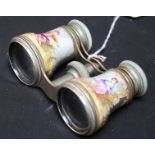 A pair of 19th century French painted opera glasses, painted with scenes of a young couple in a