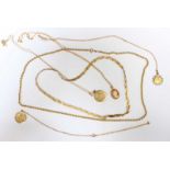 A collection of 9ct gold including two necklaces, three St. Christopher necklaces, and a cameo