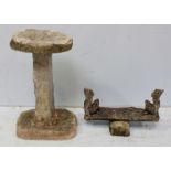 A three-piece stone garden bird table, together with a reconstituted stone pixie see-saw garden