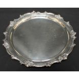 A Sterling silver circular salver, with moulded floral rim. Stamped .925 Sterling. 24 cm diameter.