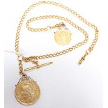 A heavy 18ct gold Albert chain, with attached Edwardian 1902 22ct gold sovereign and a gold plated