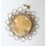 A 1912 Dutch 10 Guilder 21.6ct gold coin in a 9ct gold mount. Coin 6.7 grams, mount 4.4 grams.