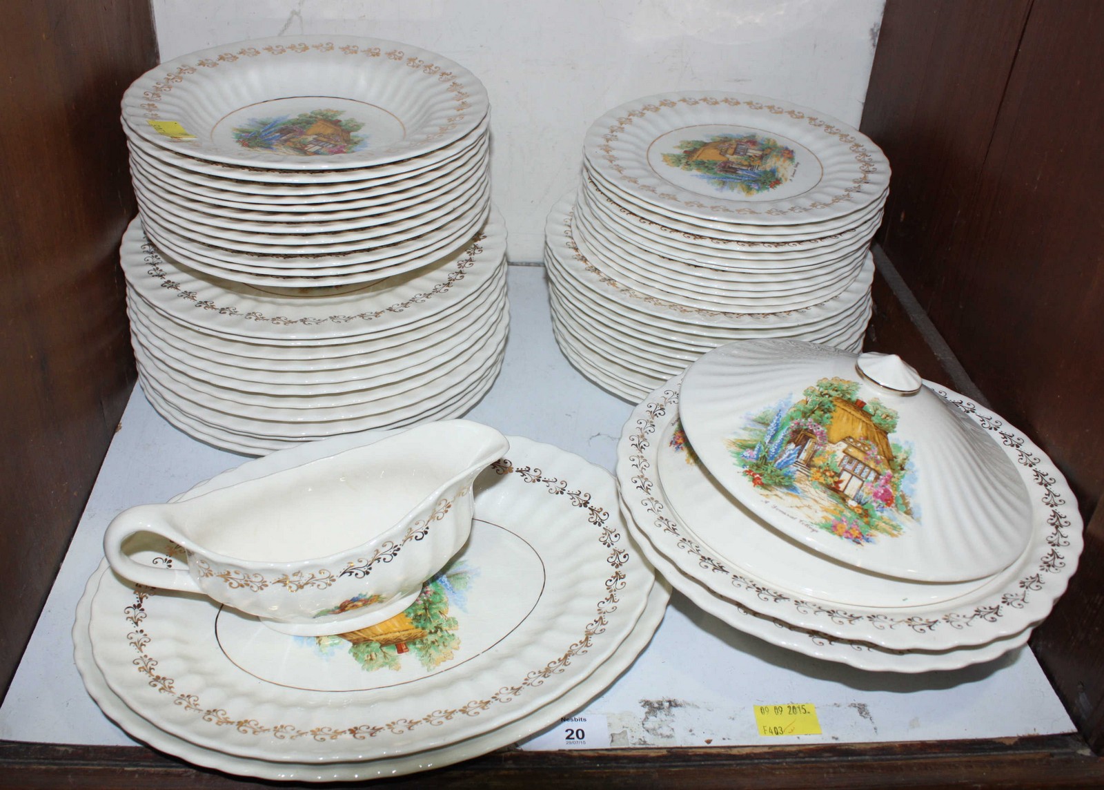 SECTION 20. A Wade porcelain dinner service, with transfer printed decoration of cottages.