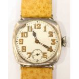 An early 20th Century gents Rolex in silver case with white dial, Arabic numerals denoting hours and