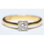 An 18ct gold solitaire diamond ring illusion set with a round brilliant cut diamond, the diamond