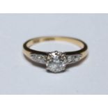 An 18ct gold, platinum and diamond ring, with a brilliant cut diamond weighing approximately 0.