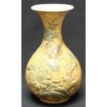 A Lladro porcelain baluster vase, moulded in relief with birds amidst branches, leaves and