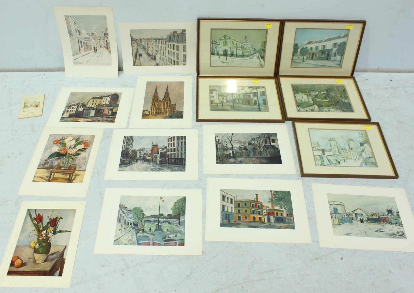 A collection of five framed and nine unframed prints of impressionist street scenes