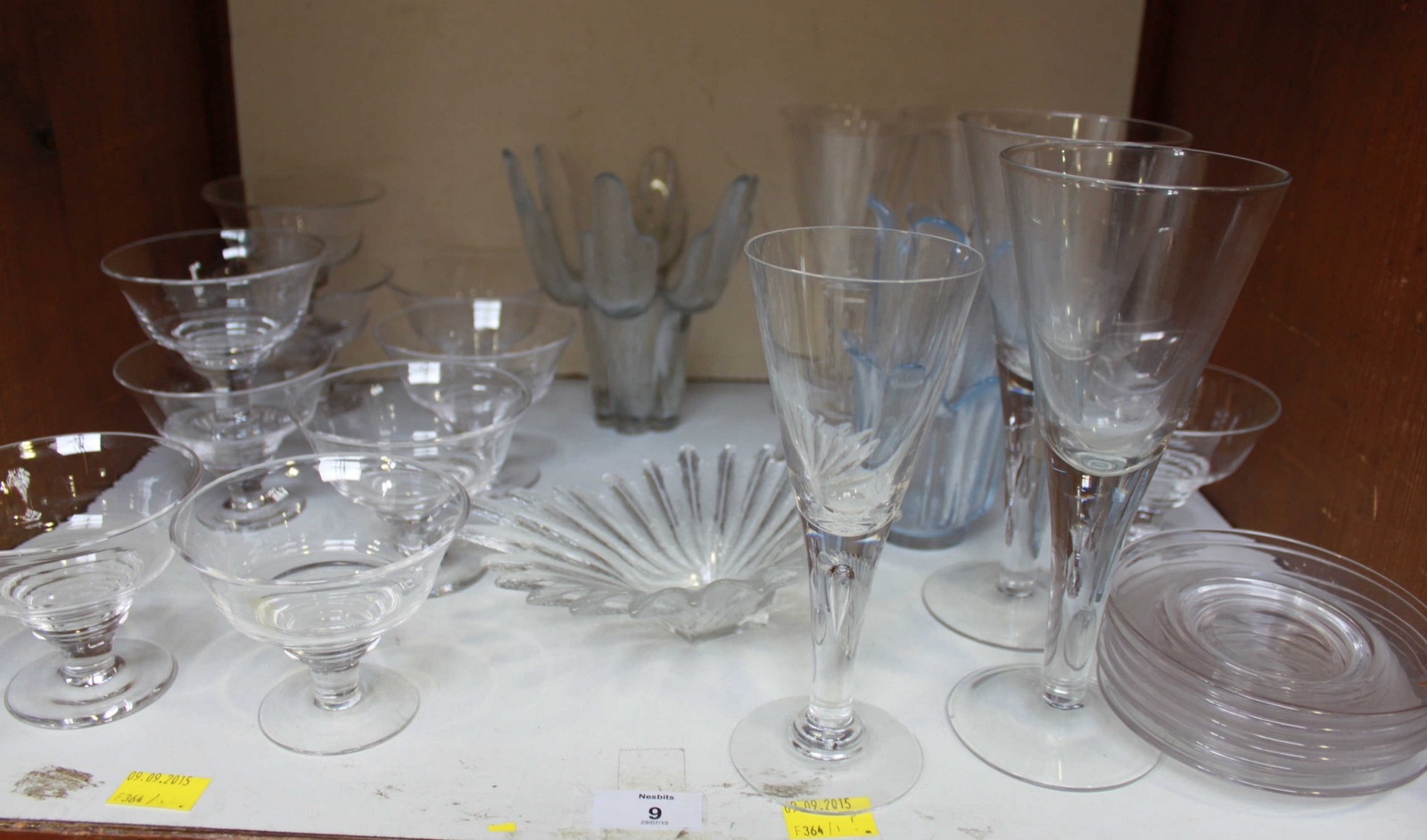 SECTION 9. A collection of assorted glassware including dessert dishes and bark vases.